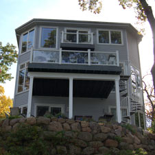 This stylish deck provides lake access via a spiral staircase.