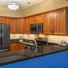 In this condo kitchen refresh, new countertops and appliances add a modern flair and fresh feel to the space.