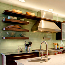 This custom kitchen features a unique, modern aesthetic with a chalkboard as its focal point.