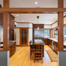 An open and updated kitchen space with a modern, functional aesthetic.